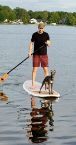 Rory paddleboarding with Jeff