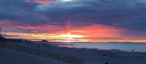 Saturday Sun Rising Through the Clouds on Rockaway Beach